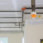 Automatic fire sprinkler system install on pipe ceiling background in office building